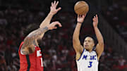 Nov 16, 2025; Houston, Texas, USA; Orlando Magic guard Desmond Bane (3) shoots the ball as Houston Rockets center Steven Adams (12) defends during the fourth quarter at Toyota Center. Mandatory Credit: Troy Taormina-Imagn Images