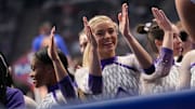 Mar 22, 2025; Birmingham AL, USA; LSU gymnast LSU gymnast Livvy Dunne celebrates with teammates during Session 2 of the SEC Gymnastics Championship at Legacy Arena in Birmingham, Alabama. LSU won the event to claim the SEC crown.