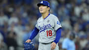 Los Angeles Dodgers pitcher Yoshinobu Yamamoto (18) reacts in the sixth inning against the Toronto Blue Jays during Game 6 of the 2025 MLB World Series at Rogers Centre.