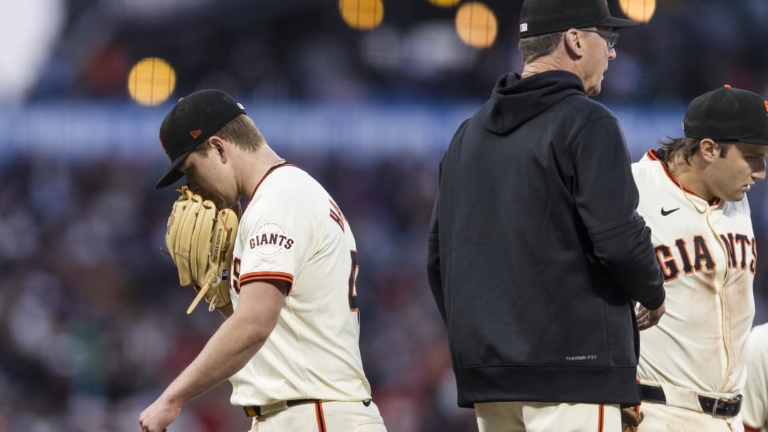 Jun 10, 2024; San Francisco, California, USA; San Francisco Giants manager Bob Melvin (6) lifts starting pitcher Kyle Harrison (45) during the seventh inning of the game against the Houston Astros at Oracle Park. Mandatory Credit: John Hefti-USA TODAY Sports