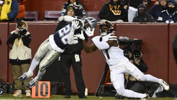 Jan 7, 2024; Landover, Maryland, USA; Dallas Cowboys cornerback DaRon Bland (26) intercepts a pass intended for Washington Commanders wide receiver Terry McLaurin (17) during the second half at FedExField. Mandatory Credit: Brad Mills-USA TODAY Sports