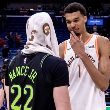 Apr 5, 2024; New Orleans, Louisiana, USA; San Antonio Spurs center Victor Wembanyama (1) talks to New Orleans Pelicans forward Larry Nance Jr. (22) after the game  at Smoothie King Center. 