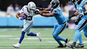 Dallas Cowboys running back Jaydon Blue runs with the ball during the second quarter against the Carolina Panthers.