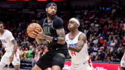 Mar 15, 2024; New Orleans, Louisiana, USA;  New Orleans Pelicans forward Brandon Ingram (14) dribbles against LA Clippers guard Terance Mann (14) during the first half at Smoothie King Center.