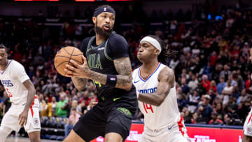 Mar 15, 2024; New Orleans, Louisiana, USA;  New Orleans Pelicans forward Brandon Ingram (14) dribbles against LA Clippers guard Terance Mann (14) during the first half at Smoothie King Center.