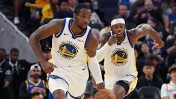 Oct 5, 2025; San Francisco, California, USA;  Golden State Warriors forward Jonathan Kuminga (1) dribbles upcourt, as guard Buddy Hield (7) trails, against the Los Angeles Lakers in the third quarter at Chase Center. Mandatory Credit: David Gonzales-Imagn Images