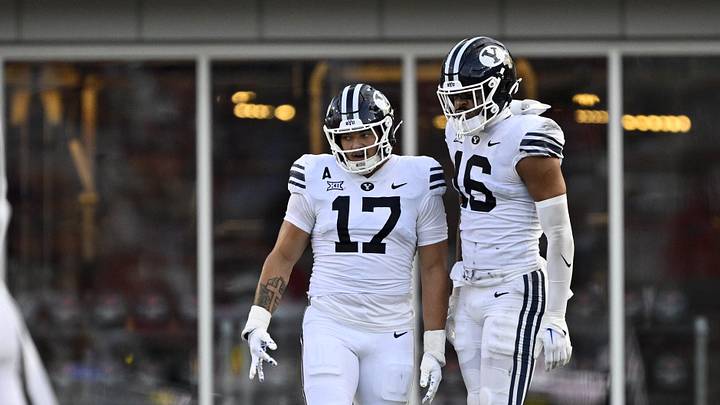 Sep 6, 2024; Dallas, Texas, USA; Brigham Young Cougars linebacker Jack Kelly (17) and linebacker Isaiah Glasker (16) in action during the game between the Southern Methodist Mustangs and the Brigham Young Cougars at Gerald J. Ford Stadium. Mandatory Credit: Jerome Miron-Imagn Images