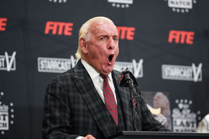 Ric Flair exclaims his trademark "WOOOOO!" at his Last Match press conference.