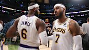 Oct 24, 2021; Los Angeles, California, USA; Los Angeles Lakers forward LeBron James (6) and forward Carmelo Anthony (7) celebrate a win after beating the Memphis Grizzlies 121-118 at Staples Center.  Mandatory Credit: Kiyoshi Mio-Imagn Images