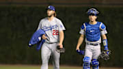 Los Angeles Dodgers starting pitcher Clayton Kershaw and catcher Austin Barnes walk to the dugout before game five of the 2017 NLCS.