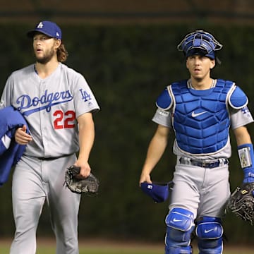 Los Angeles Dodgers starting pitcher Clayton Kershaw and catcher Austin Barnes walk to the dugout before game five of the 2017 NLCS.