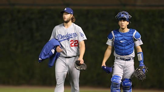 Los Angeles Dodgers starting pitcher Clayton Kershaw and catcher Austin Barnes walk to the dugout before game five of the 2017 NLCS.