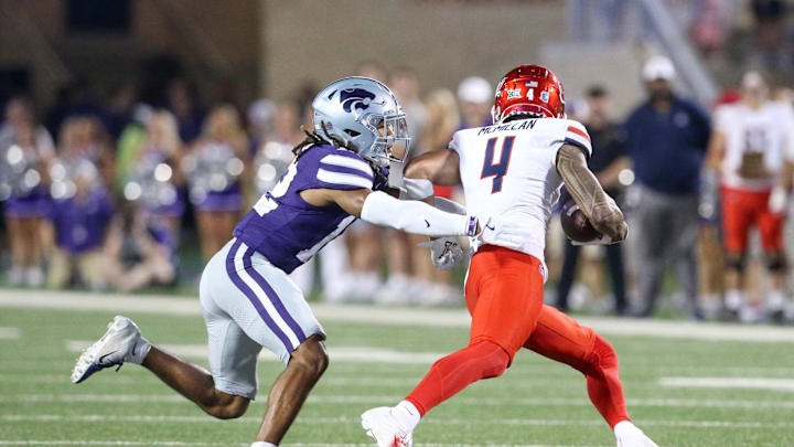 Sep 13, 2024; Manhattan, Kansas, USA; Kansas State Wildcats safety Nickendre Stiger (12) chases Arizona Wildcats wide receiver Tetairoa McMillan (4) during the third  quarter at Bill Snyder Family Football Stadium. Mandatory Credit: Scott Sewell-Imagn Images