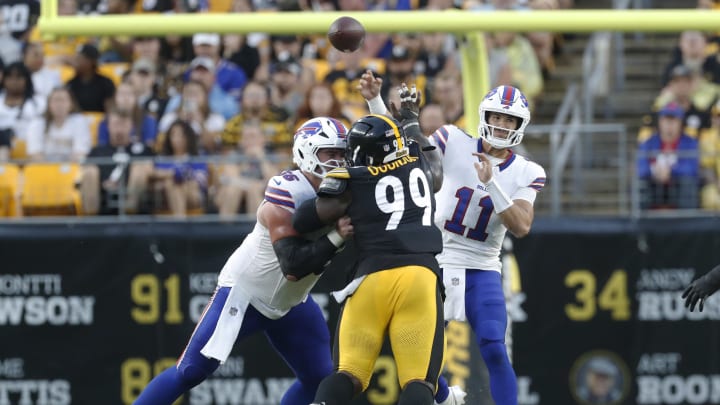 Aug 17, 2024; Pittsburgh, Pennsylvania, USA;  Buffalo Bills quarterback Mitchell Trubisky (11) passes against the Pittsburgh Steelers during the second quarter at Acrisure Stadium. Mandatory Credit: Charles LeClaire-USA TODAY Sports