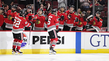 Oct 17, 2024; Chicago, Illinois, USA; Chicago Blackhawks center Jason Dickinson (16) celebrates his goal against the San Jose Sharks during the third period at United Center. Mandatory Credit: David Banks-Imagn Images