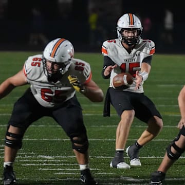 West Des Moines Valley quarterback Drake DeGroote takes the snap against Ankeny during a high school football game Oct 17, 2025, at Ankeny Stadium in Ankeny. Mandatory Credit: Bryon Houlgrave-The Des Moines Register