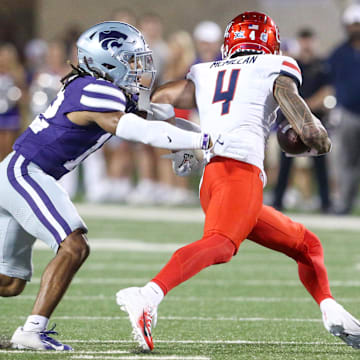 Sep 13, 2024; Manhattan, Kansas, USA; Kansas State Wildcats safety Nickendre Stiger (12) chases Arizona Wildcats wide receiver Tetairoa McMillan (4) during the third  quarter at Bill Snyder Family Football Stadium.