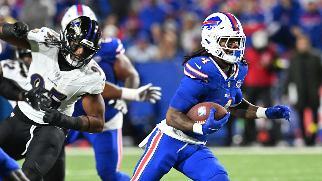 Sep 7, 2025; Orchard Park, New York, USA; Buffalo Bills running back James Cook (4) carries the ball against the Baltimore Ravens in the third quarter at Highmark Stadium. Mandatory Credit: Mark Konezny-Imagn Images