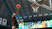 Mar 1, 2025; Chapel Hill, North Carolina, USA;  Miami (Fl) Hurricanes guard Matthew Cleveland (0) shoots as North Carolina Tar Heels forward Jae'Lyn Withers (24) defends in the first half at Dean E. Smith Center. Mandatory Credit: Bob Donnan-Imagn Images