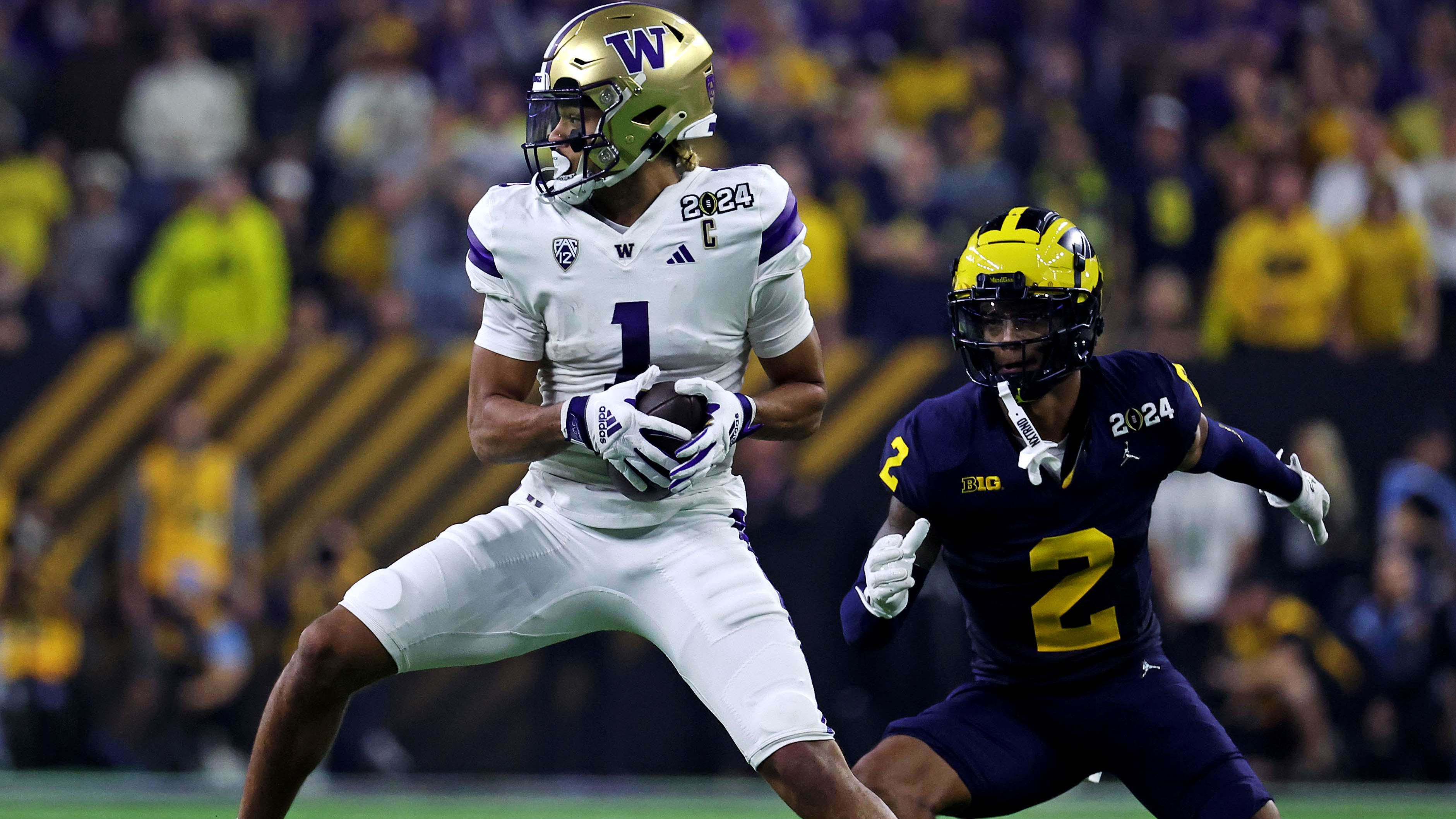 Rome Odunze hauls in a  catch in the national championship game for Washington.