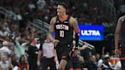 Nov 21, 2025; Houston, Texas, USA; Houston Rockets forward Jabari Smith Jr. (10) reacts after making a basket during the fourth quarter against the Denver Nuggets at Toyota Center. Mandatory Credit: Troy Taormina-Imagn Images
