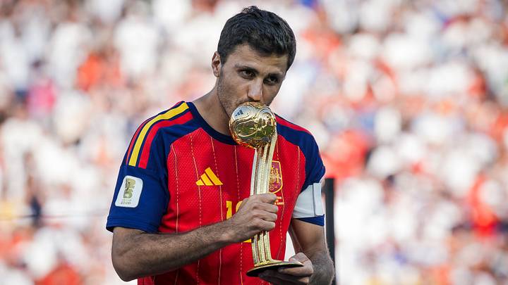 Rodri of Spain kisses the 'Golden Ball' award 