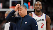 Feb 2, 2025; Toronto, Ontario, CAN; LA Clippers coach Tyronn Lue scratches his head after calling a timeout as forward Kawhi Leonard (2) walks past in the first half against the Toronto Raptors at Scotiabank Arena.