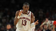 Apr 5, 2025; San Antonio, TX, USA; Auburn Tigers guard Miles Kelly (13) reacts after a play against the Florida Gators during the first half in the semifinals of the men's Final Four of the 2025 NCAA Tournament at the Alamodome. Mandatory Credit: Bob Donnan-Imagn Images