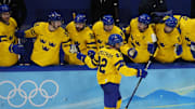 Feb 18, 2022; Beijing, China; Team Sweden forward Joakim Nordstrom (42) celebrates with teammates after scoring a goal against Team ROC in a shootout during the Beijing 2022 Olympic Winter Games at National Indoor Stadium. Mandatory Credit: George Walker IV-Imagn Images