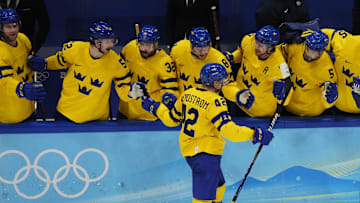 Feb 18, 2022; Beijing, China; Team Sweden forward Joakim Nordstrom (42) celebrates with teammates after scoring a goal against Team ROC in a shootout during the Beijing 2022 Olympic Winter Games at National Indoor Stadium. Mandatory Credit: George Walker IV-Imagn Images