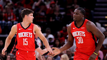 Oct 27, 2025; Houston, Texas, USA; Houston Rockets guard Reed Sheppard (15) congratulates Houston Rockets center Clint Capela (30) after a made basket against the Brooklyn Nets during the fourth quarter at Toyota Center. Mandatory Credit: Erik Williams-Imagn Images
