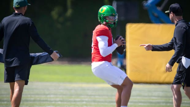 Oregon quarterback Dillon Gabriel looks to pass during the Ducks’ fall camp