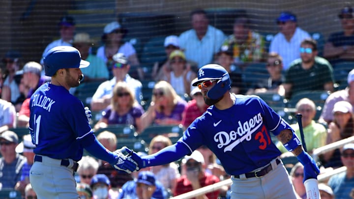 Mar 24, 2022; Salt River Pima-Maricopa, Arizona, USA; Los Angeles Dodgers left fielder AJ Pollock (11) celebrates with right fielder Kevin Pillar (37) after hitting a solo home run in the third inning against the Colorado Rockies during spring training at Salt River Fields at Talking Stick. Mandatory Credit: Matt Kartozian-Imagn Images Mar 24, 2022; Salt River Pima-Maricopa, Arizona, USA; Los Angeles Dodgers left fielder AJ Pollock (11) celebrates with right fielder Kevin Pillar (37) after hitting a solo home run in the third inning against the Colorado Rockies during spring training at Salt River Fields at Talking Stick. Mandatory Credit: Matt Kartozian-Imagn Images
