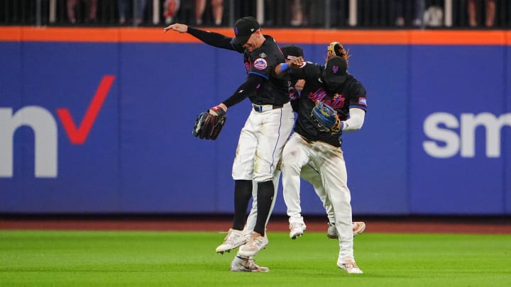 Jun 14, 2024; New York City, New York, USA; New York Mets left fielder Brandon Nimmo (9) and center fielder Tyrone Taylor (15) and right fielder Starling Marte (6) celebrate the victory against the San Diego Padres after the ninth inning at Citi Field. Mandatory Credit: Gregory Fisher-USA TODAY Sports