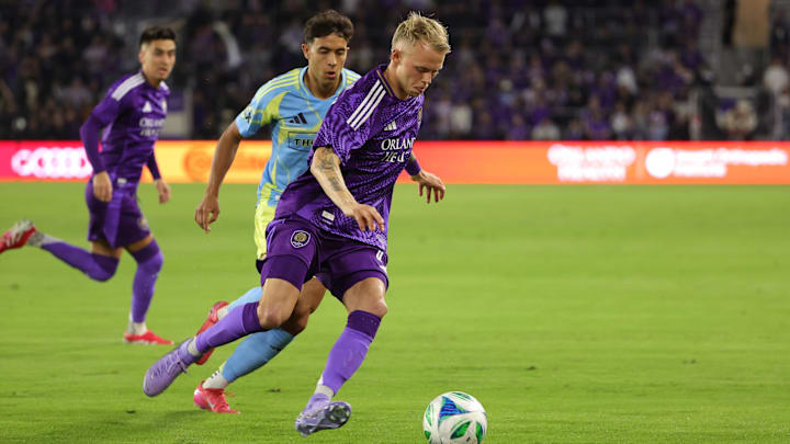 Feb 22, 2025; Orlando, Florida, USA; Orlando City midfielder Dagur Thorhallsson (17) controls the ball against Philadelphia Union midfielder Quinn Sullivan (33) in the first half at Inter&Co Stadium. Mandatory Credit: Mike Watters-Imagn Images