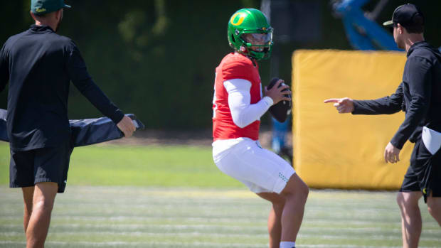 Oregon quarterback Dillon Gabriel looks to pass during the Ducks’ fall camp