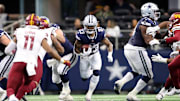 Jan 5, 2025; Arlington, Texas, USA; Dallas Cowboys running back Rico Dowdle (23) runs the ball against the Washington Commanders during the second quarter at AT&T Stadium. Mandatory Credit: Tim Heitman-Imagn Images