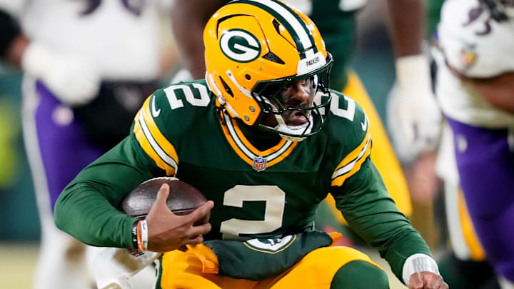 Dec 27, 2025; Green Bay, Wisconsin, USA; Green Bay Packers quarterback Malik Willis (2) runs the ball during the third quarter against the Baltimore Ravens at Lambeau Field.