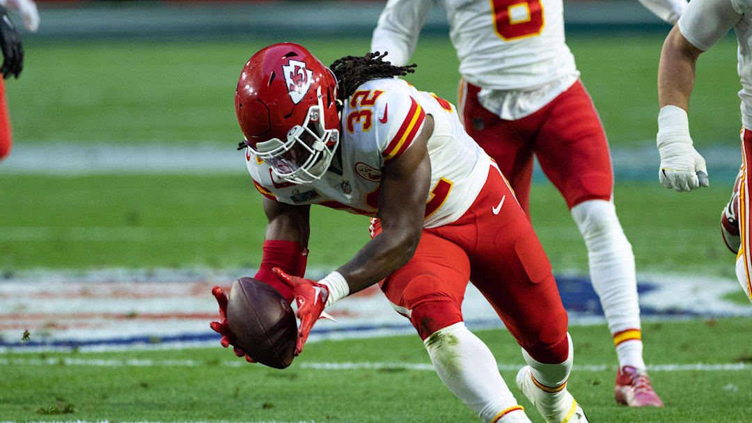 Feb 12, 2023; Glendale, Arizona, US; Kansas City Chiefs linebacker Nick Bolton (32) recovers a fumble against the Philadelphia Eagles in Super Bowl LVII at State Farm Stadium. 