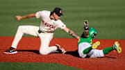 Oregon State infielder Aiva Arquette (38) tags out Oregon catcher Anson Aroz (77) during the game on Tuesday, April 29, 2025 at Goss Stadium in Corvallis, Ore.