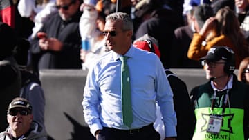 Nov 16, 2024; Boulder, Colorado, USA; Fox Sports reporter Urban Meyer walks the sidelines in the first quarter between the Utah Utes against the Colorado Buffaloes at Folsom Field. Mandatory Credit: Ron Chenoy-Imagn Images