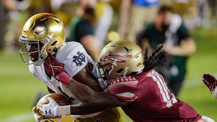 Notre Dame Fighting Irish wide receiver Kevin Austin Jr. (4) scores a touchdown as Florida State Seminoles defensive back Travis Jay (18) tackles him in the end zone. The Notre Dame Fighting Irish defeat the Florida State Seminoles 41-38 at Doak Campbell Stadium on Sunday, Sept. 5, 2021.

Fsu V Notre Dame1140