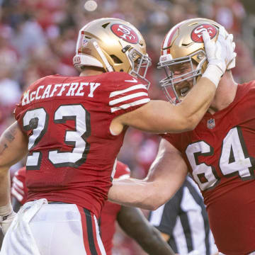 September 21, 2023; Santa Clara, California, USA; San Francisco 49ers running back Christian McCaffrey (23) is congratulated by center Jake Brendel (64) after scoring a touchdown against the New York Giants during the second quarter at Levi's Stadium. Mandatory Credit: Kyle Terada-USA TODAY Sports