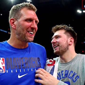 May 15, 2022; Phoenix, Arizona, USA; Dallas Mavericks guard Luka Doncic (77) greets former player Dirk Nowitzki after beating the Phoenix Suns in game seven of the second round for the 2022 NBA playoffs at Footprint Center. Mandatory Credit: Mark J. Rebilas-Imagn Images