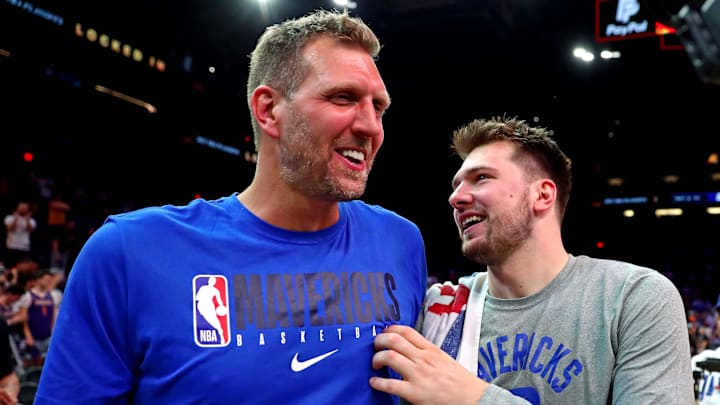 May 15, 2022; Phoenix, Arizona, USA; Dallas Mavericks guard Luka Doncic (77) greets former player Dirk Nowitzki after beating the Phoenix Suns in game seven of the second round for the 2022 NBA playoffs at Footprint Center. Mandatory Credit: Mark J. Rebilas-Imagn Images