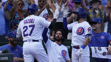 Chicago Cubs right fielder Seiya Suzuki is greeted by teammates