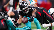Oct 26, 2025; Atlanta, Georgia, USA; Atlanta Falcons running back Bijan Robinson (7) fumbles against the Miami Dolphins in the third quarter at Mercedes-Benz Stadium. Mandatory Credit: Brett Davis-Imagn Images
