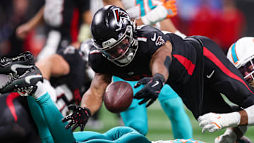 Oct 26, 2025; Atlanta, Georgia, USA; Atlanta Falcons running back Bijan Robinson (7) fumbles against the Miami Dolphins in the third quarter at Mercedes-Benz Stadium. Mandatory Credit: Brett Davis-Imagn Images
