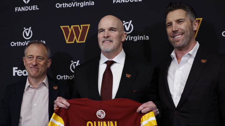 Feb 5, 2024; Ashburn, VA, USA; Washington Commanders head coach Dan Quinn (M) poses for a picture with Commanders managing partner Josh Harris (L) and Washington Commanders general manager Adam Peters (R) at an introductory press conference at Commanders Park. Mandatory Credit: Geoff Burke-USA TODAY Sports