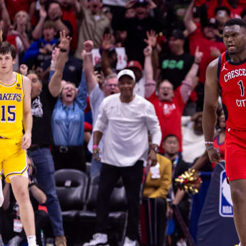 Apr 16, 2024; New Orleans, Louisiana, USA; New Orleans Pelicans forward Zion Williamson (1) reacts to making a basket against Los Angeles Lakers forward Anthony Davis (3) during the second half of a play-in game of the 2024 NBA playoffs at Smoothie King Center. 